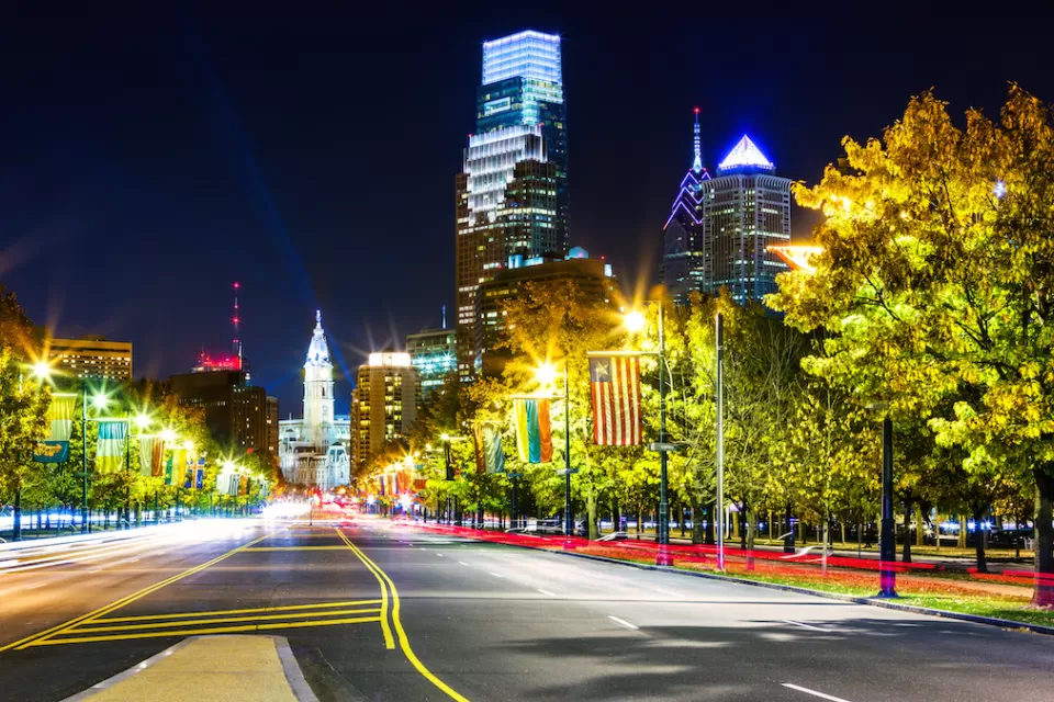 Night view of Ben Franklin Parkway in Philadelphia, Pennsylvania looking toward Philadelphia City Hall.